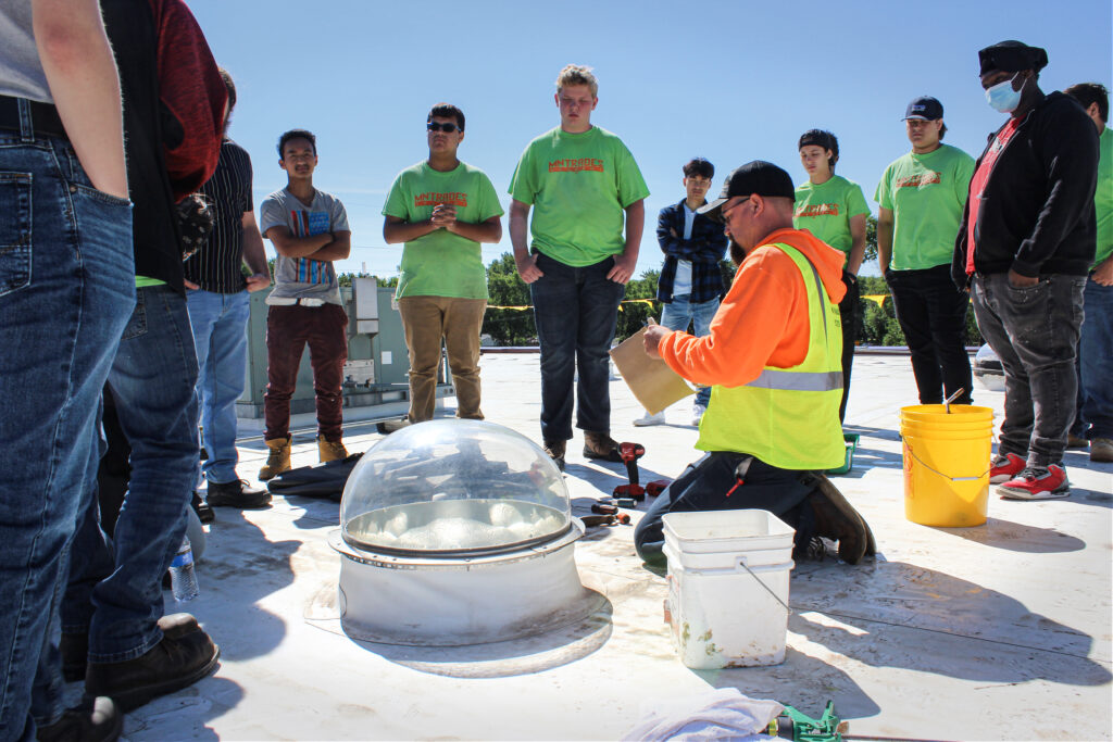 Central Roofing Company Treades Acadmeny interns on roof